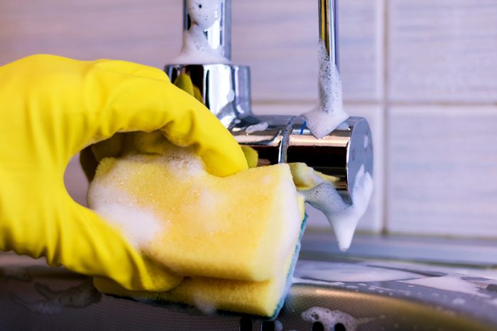 Cleaning sink and faucet close-up. housekeeping and hygiene concept. 