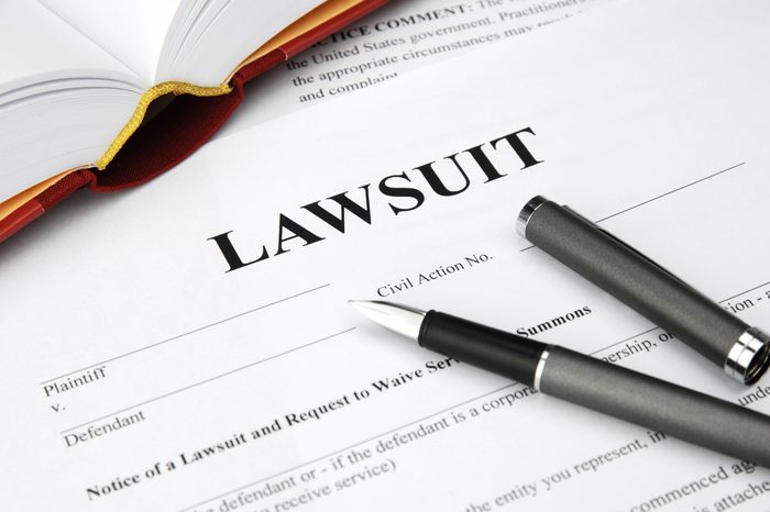 lawsuit form with filler and book