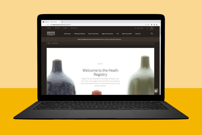 Laptop displays website, showing Heath Registry introduction and vases; background features a dual-color yellow gradient.