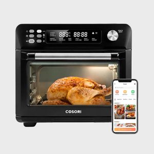 An oven roasts a chicken; a smartphone displays a cooking app.