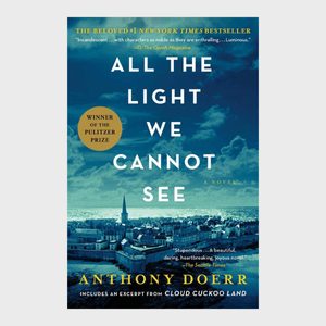 Book cover depicts a cityscape under a cloudy sky, showcasing the title 