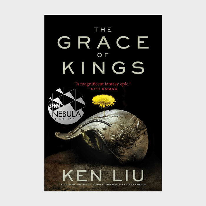 Helmet rests on the ground with a yellow flower growing from it; words read 