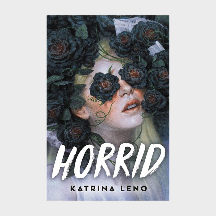 Face partially obscured by dark roses, surrounded by foliage, on a muted background. Text reads 